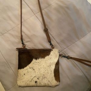 This was a gift & I’ve never used it. It comes with a matching wallet.